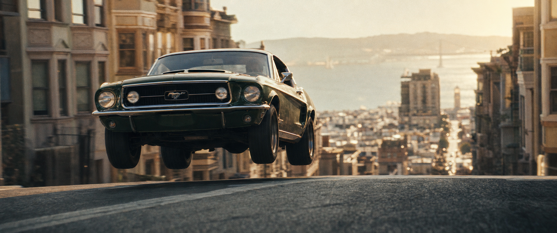 1968 Highland Green Ford Mustang GT390 airborne over a San Francisco hill