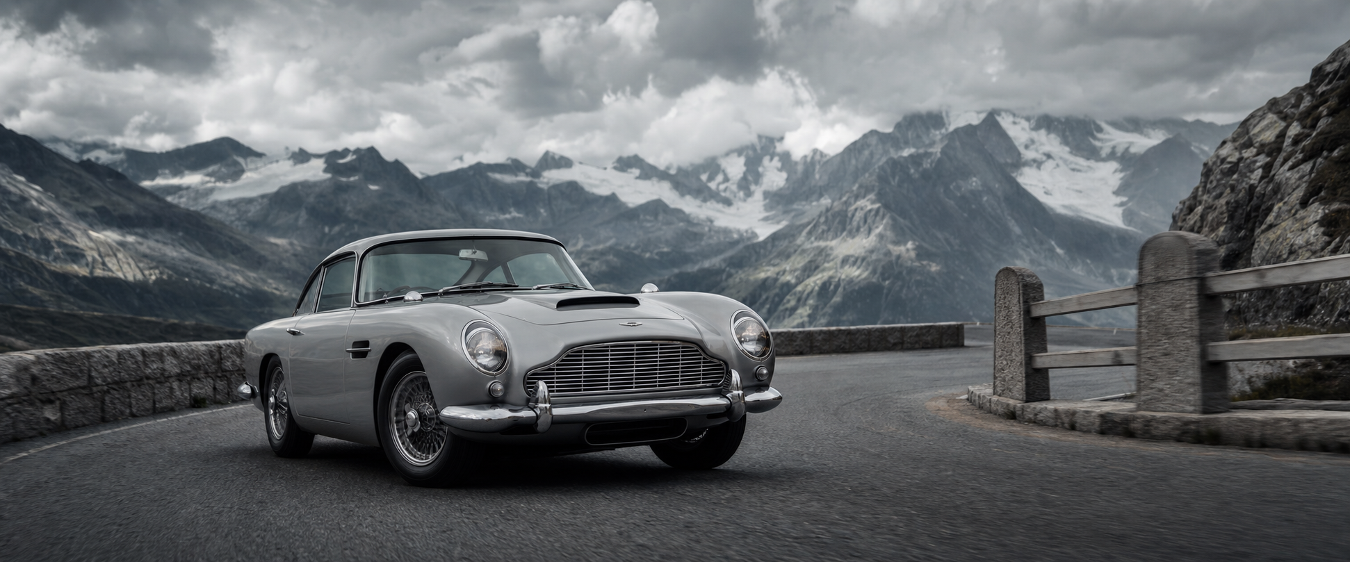 Silver Birch Aston Martin DB5 on an Alpine mountain road